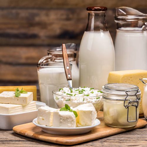 Still life with dairy product on wooden background